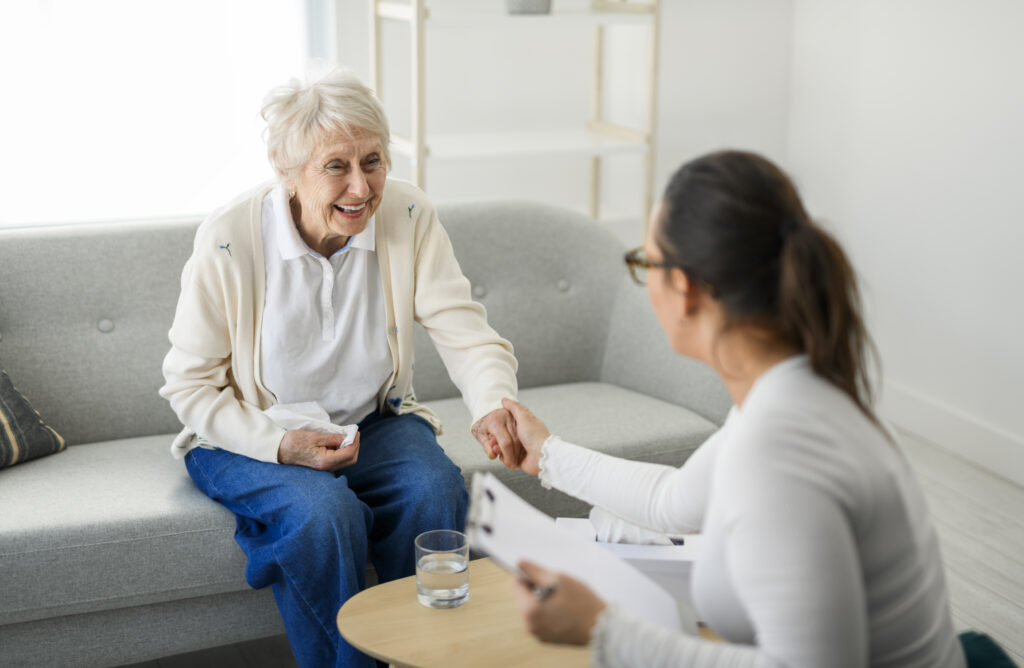 A old woman thinking with psychologist in consultation office for mind, evaluation or assessment.