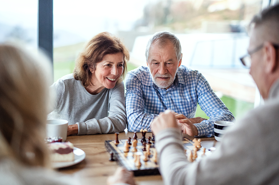 Couple playing chess together