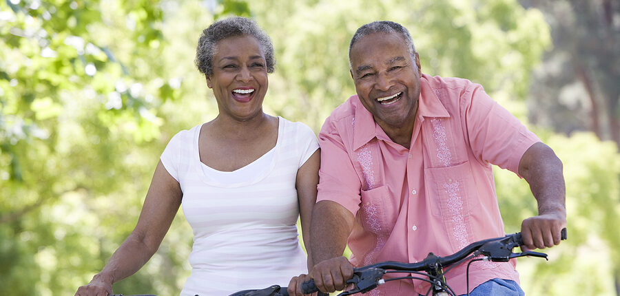 A bicycling couple demonstrating a healthy lifestyle for seniors