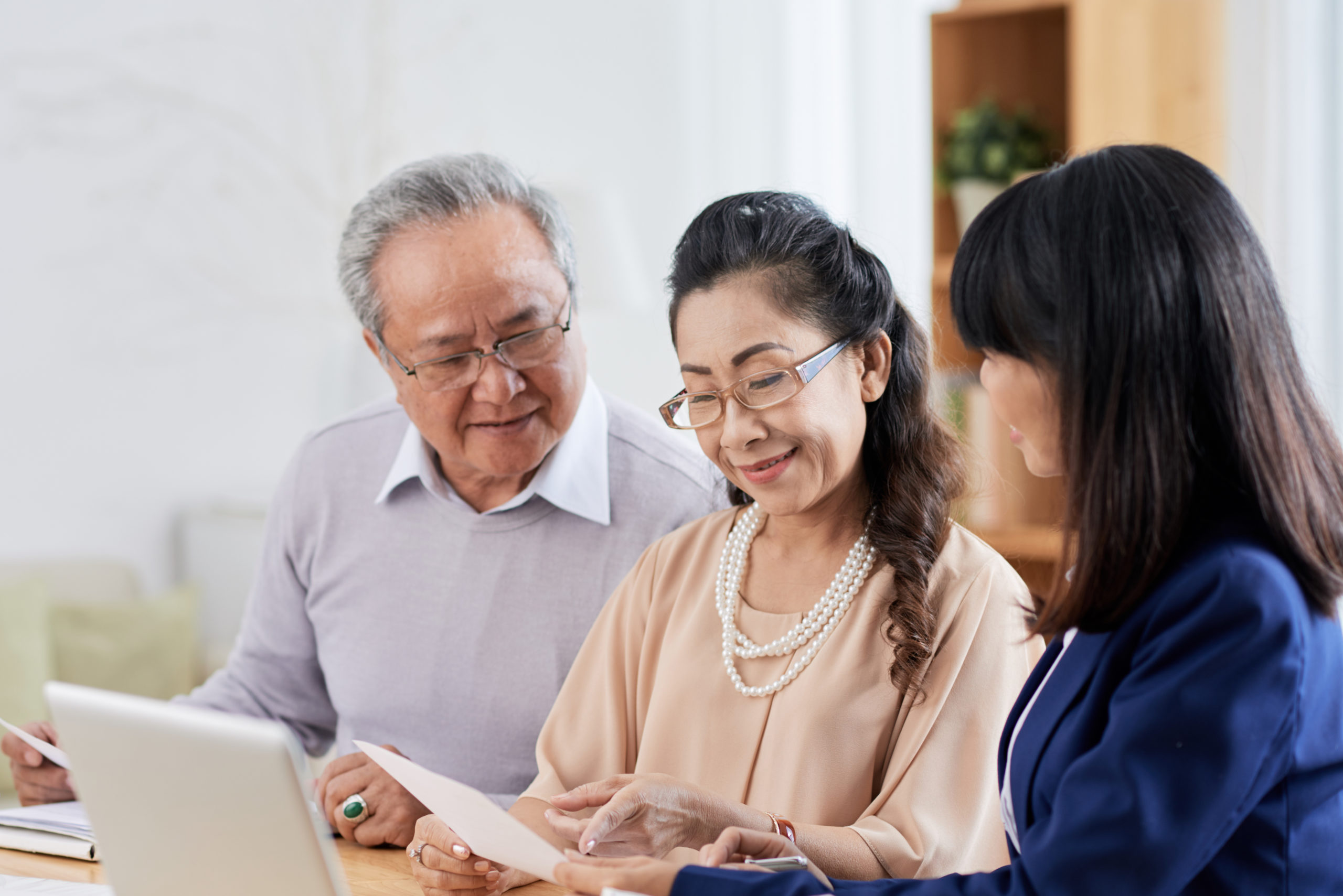 A couple meet with someone to talk about assisted living